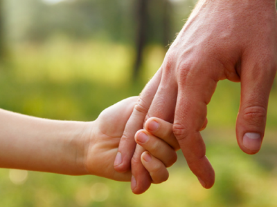 old and young people holding hands