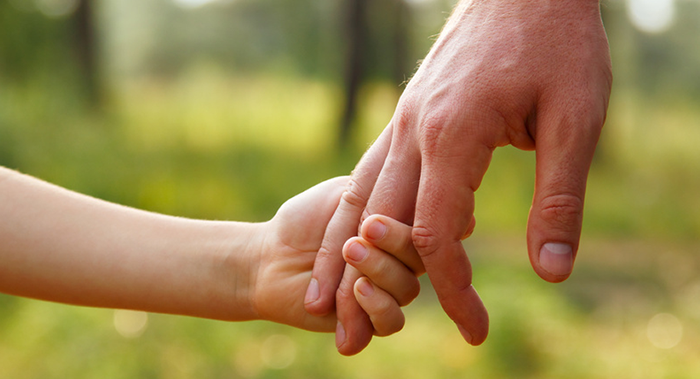 old and young people holding hands